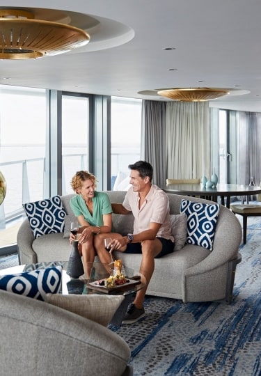 Couple relaxing inside Celebrity suite