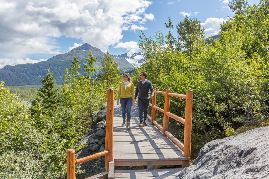 Couple trekking to Exit Glacier, one of the best hikes in Alaska