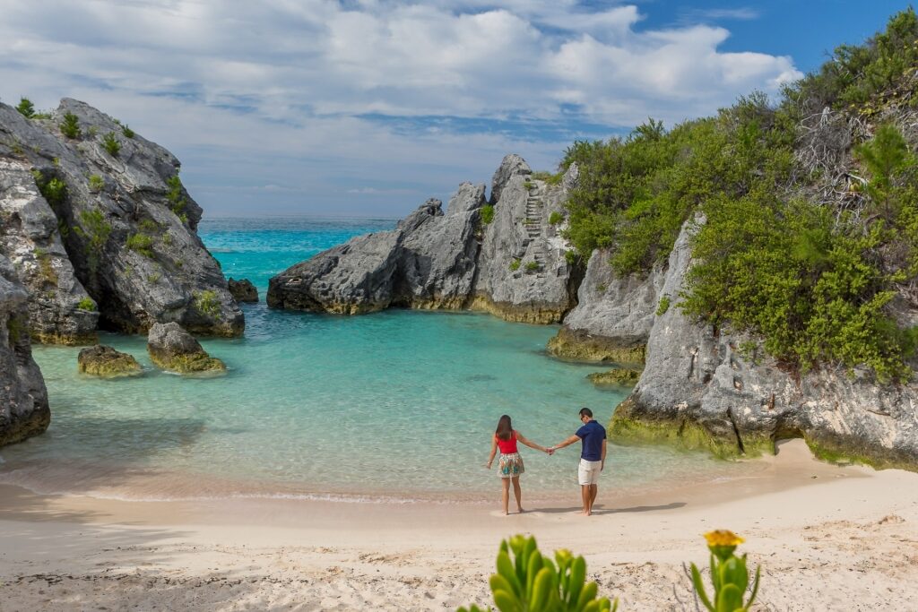 Couple exploring Jobson's Cove, Bermuda