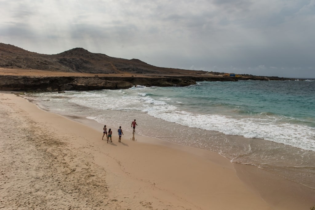 People enjoying the beach at Arikok National Park