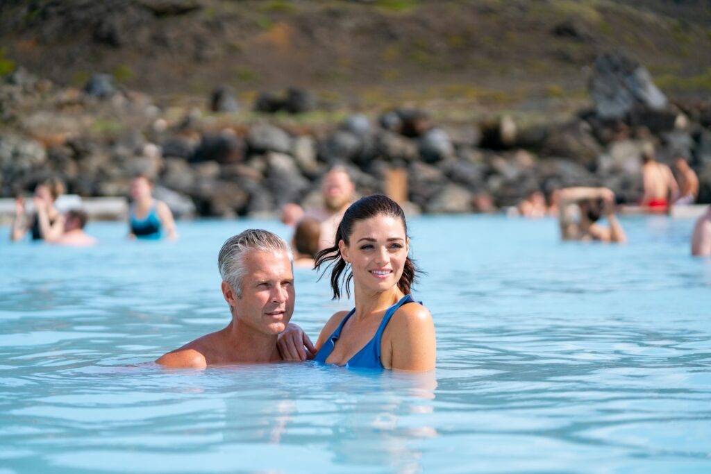 Couple enjoying Myvatn Nature Baths, Iceland