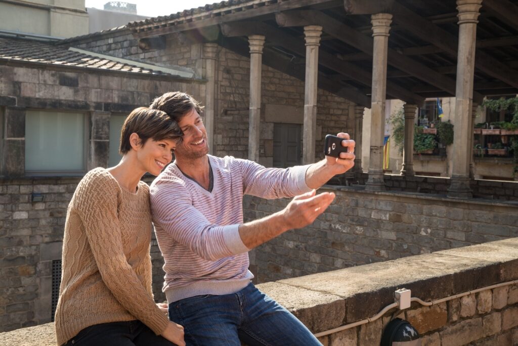 Couple taking a selfie from Barcelona, Spain
