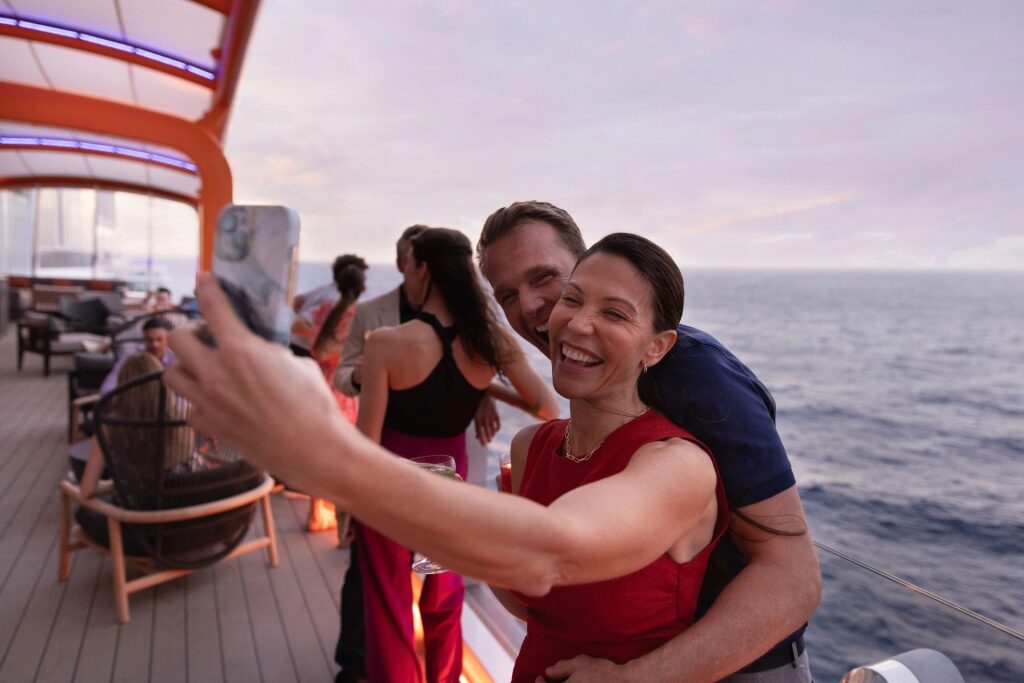 Couple taking a selfie aboard Celebrity Ascent