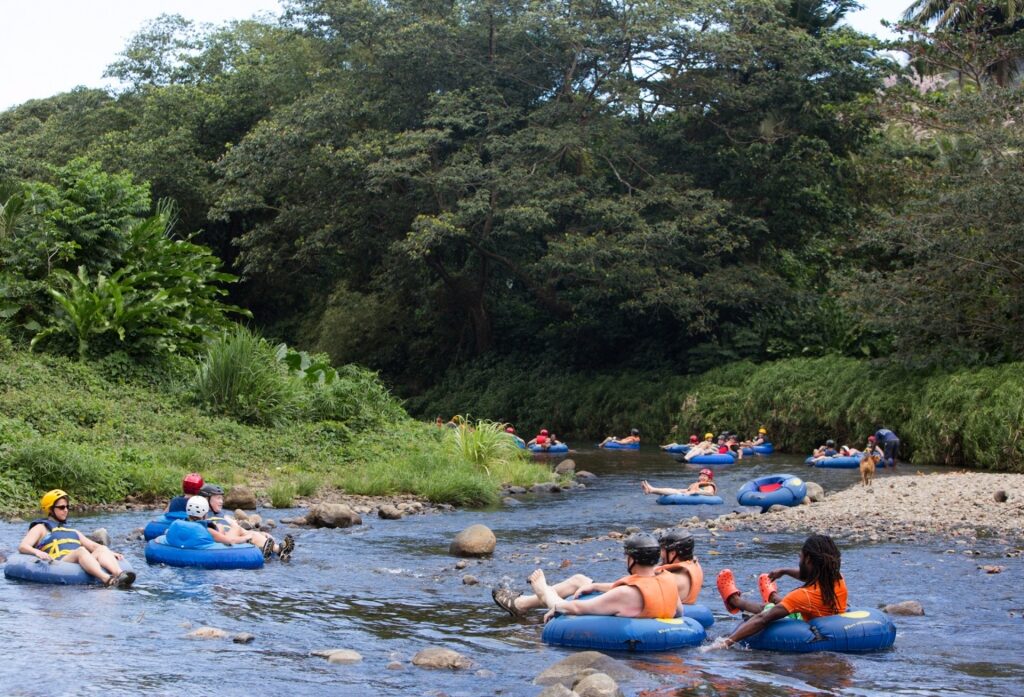 People river tubing in Hibiscus Eco-Village, Dominica