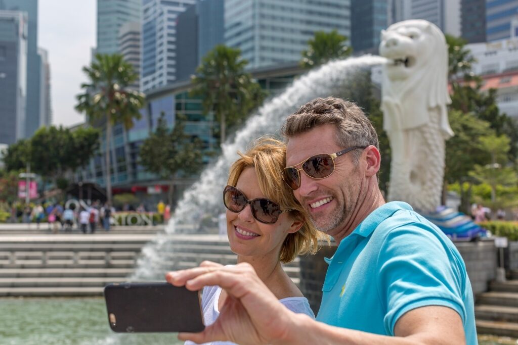 Couple taking a selfie in Merlion Park, Singapore