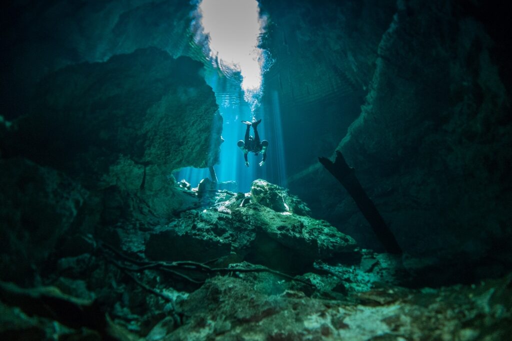 Person diving in Cenote Tajma Ha