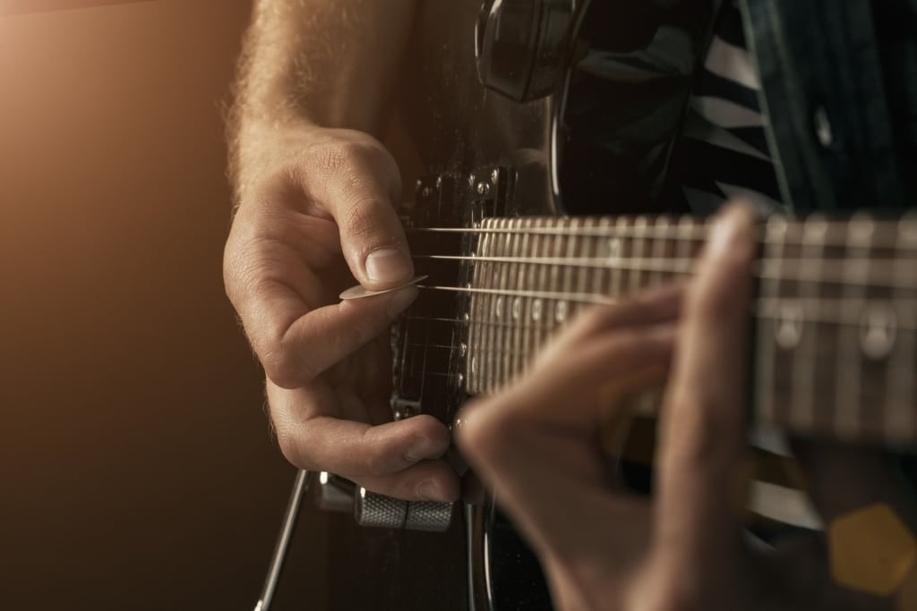 Person playing the guitar