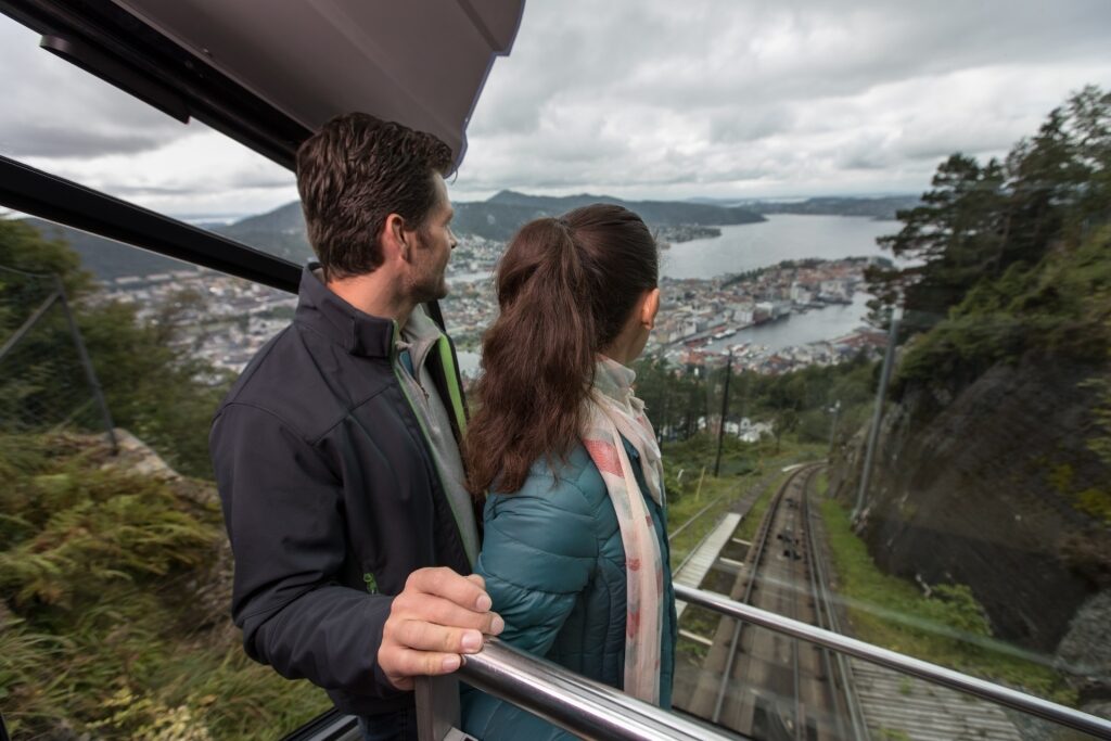 Couple riding the Fløibanen Funicular in Bergen Norway