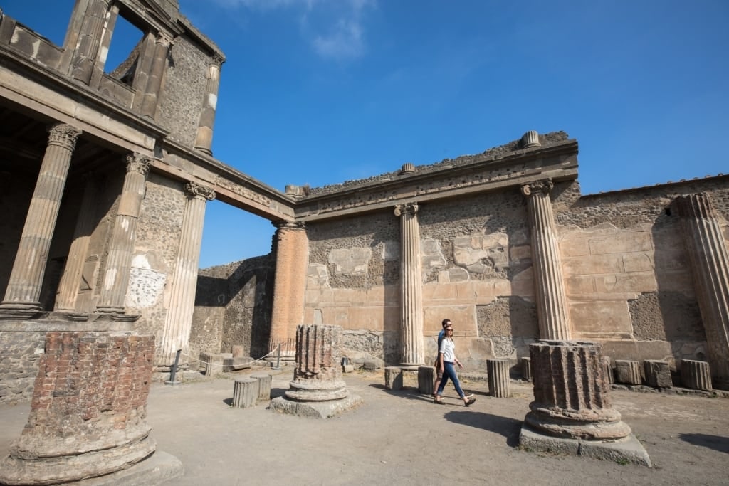 Couple exploring the ruins of Pompeii, Italy