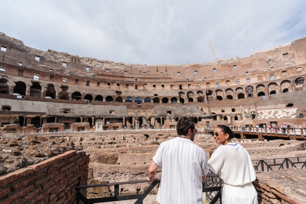 Couple exploring the Colosseum in Rome, Italy