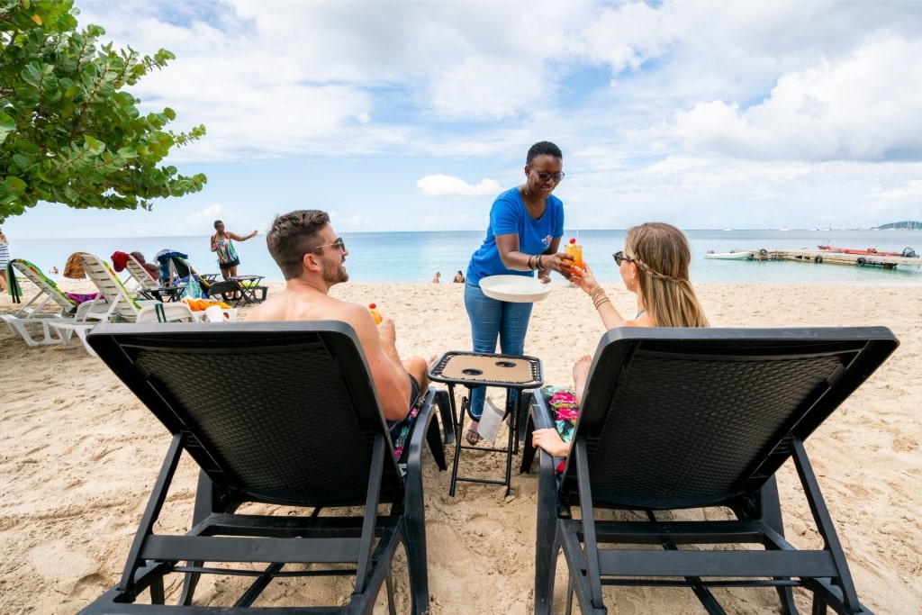 Couple lounging on a beach in Grenada