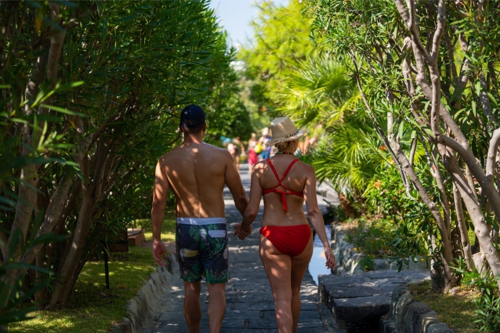 Couple walking to a beach in Naples