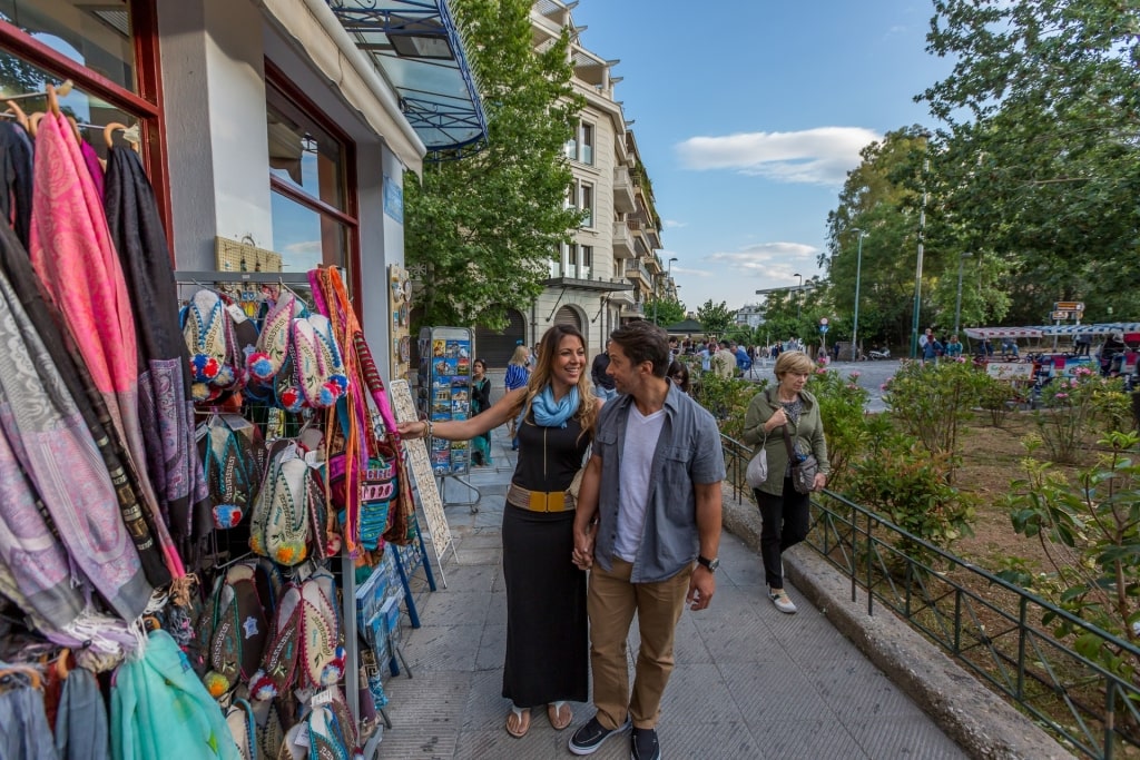 Couple shopping along Plaka neighborhood in Athens, Greece