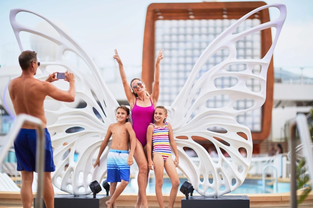 Family taking pictures from Celebrity ship