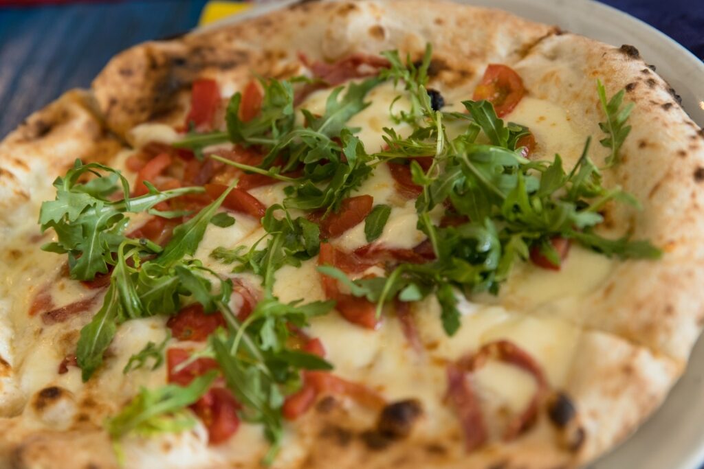 Wood-fired pizza on a platter