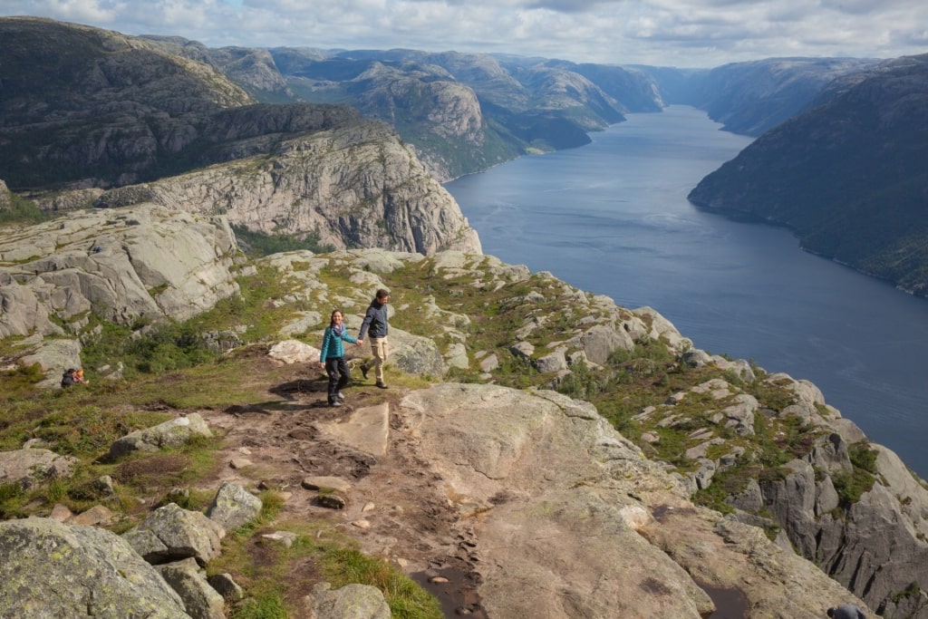 Couple hiking in Pulpit Rock, Norway