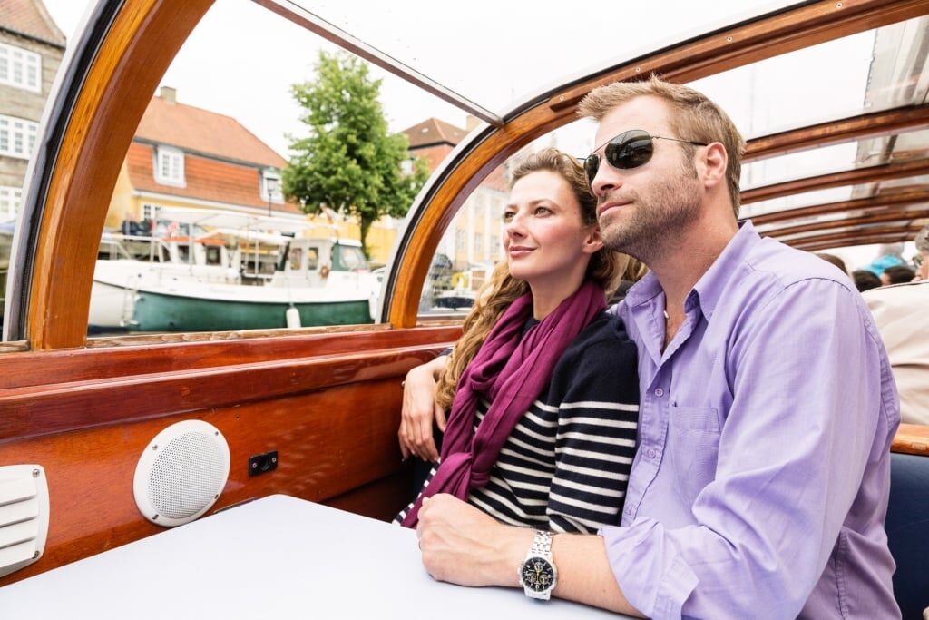 Couple on a canal cruise in Copenhagen