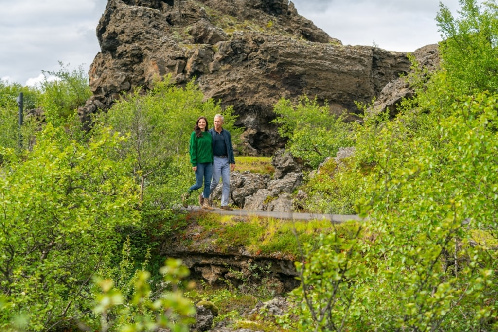 Couple exploring Dimmuborgir lava fields