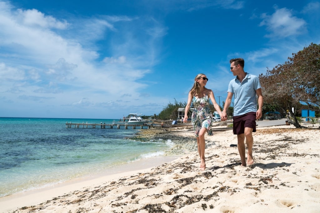 Couple exploring the beach in George Town, Grand Cayman