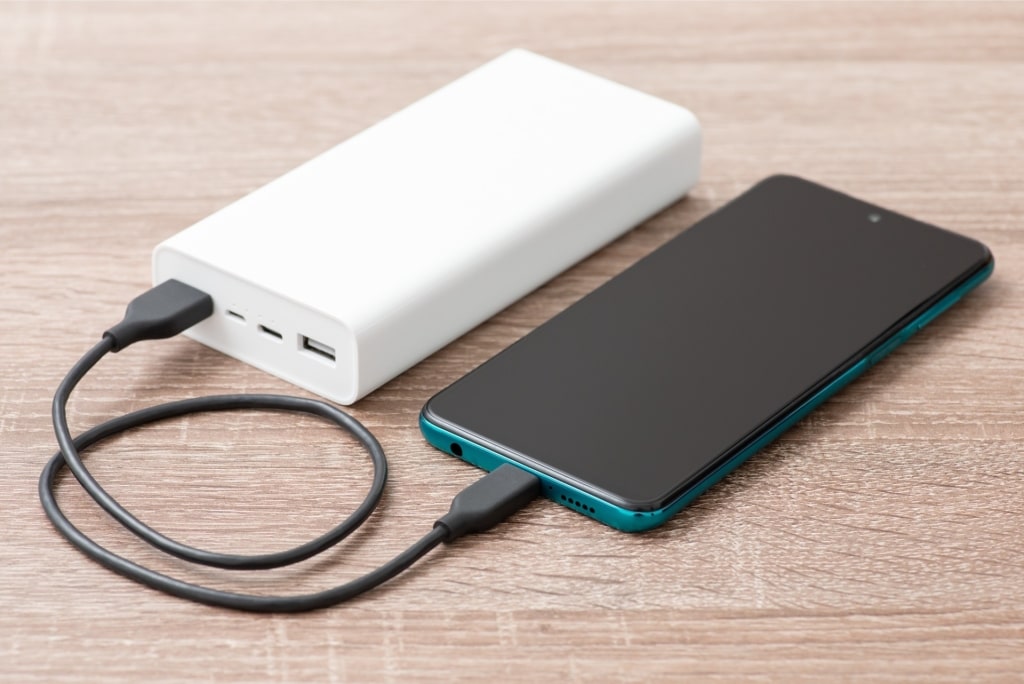 Portable charger and phone on the table