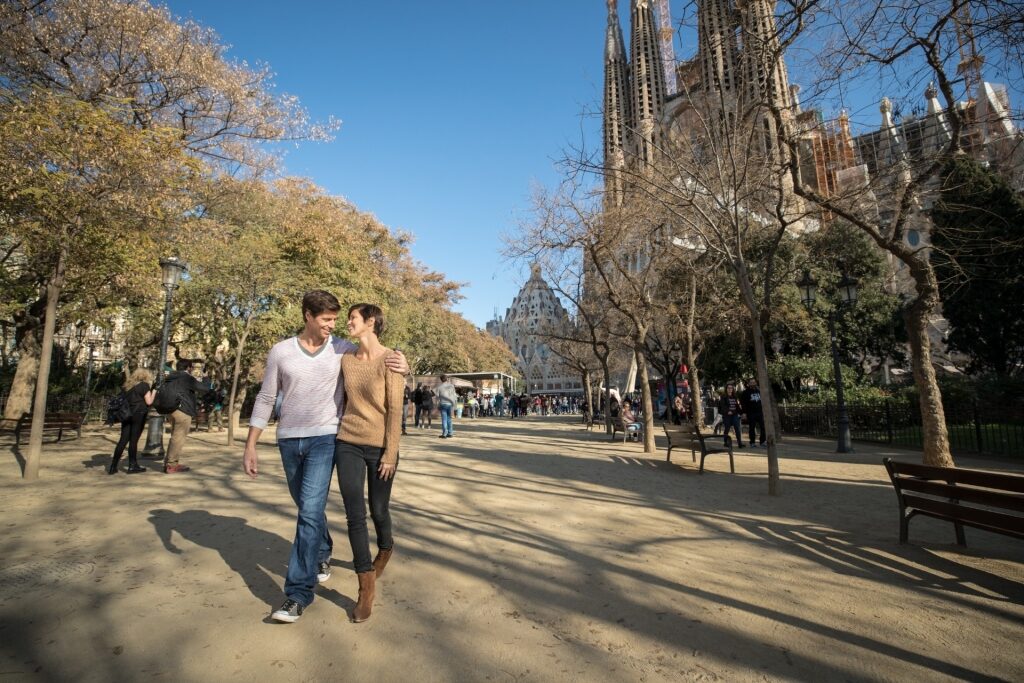 Couple exploring Sagrada Familia in Barcelona, Spain