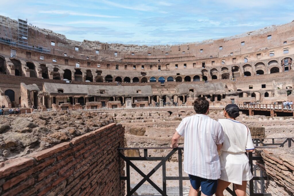 Couple admiring the Colosseum in Rome, Italy