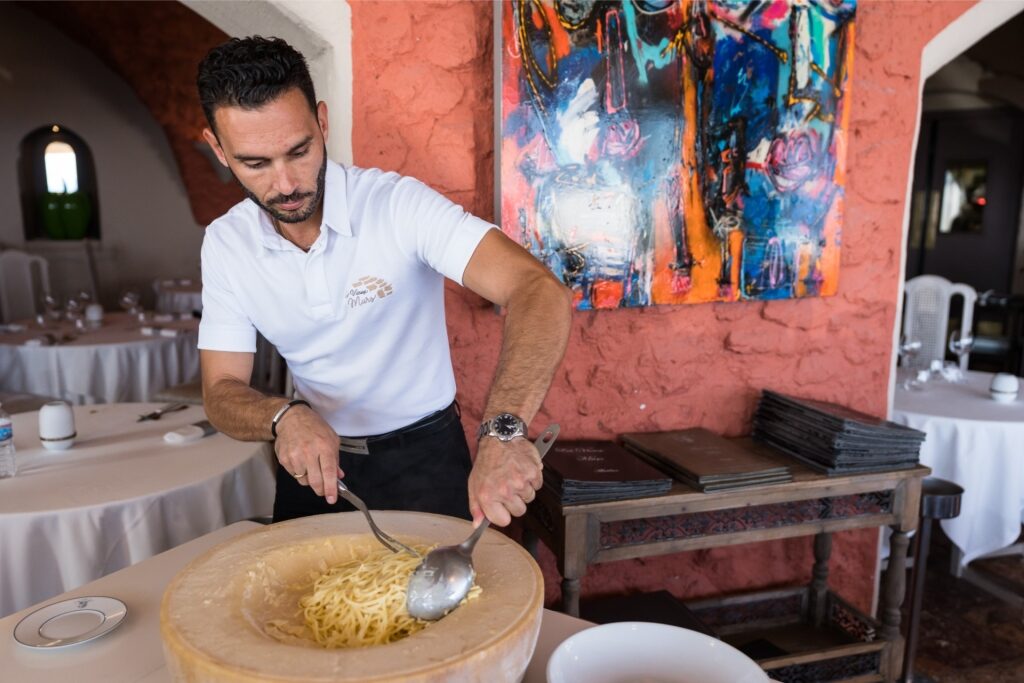 Man preparing food at a restaurant in Antibes