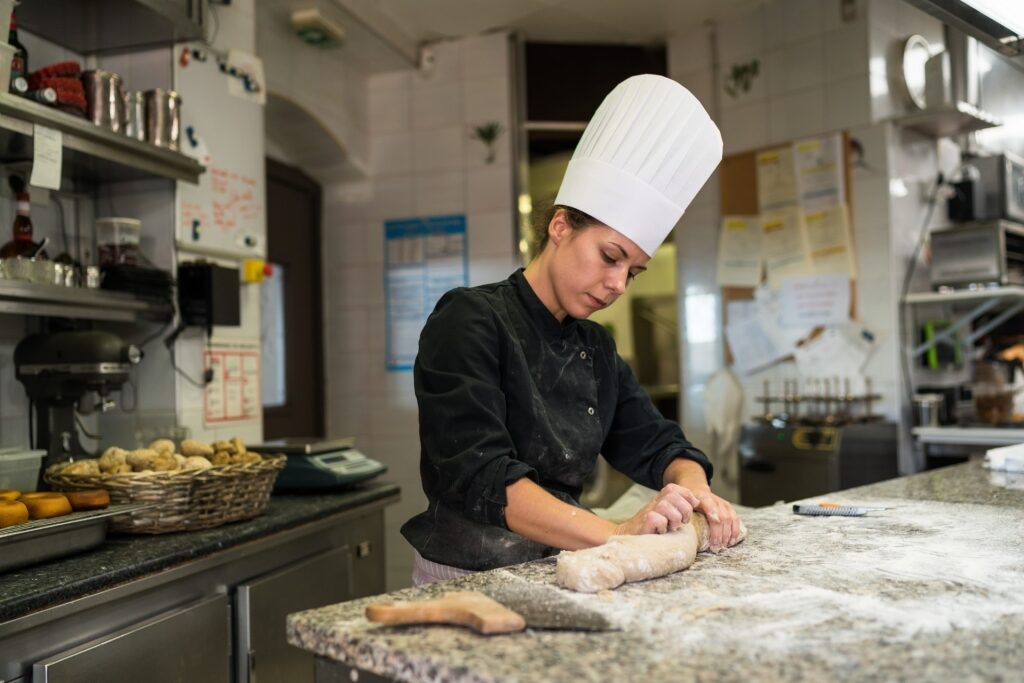 Woman preparing food at a restaurant in Antibes