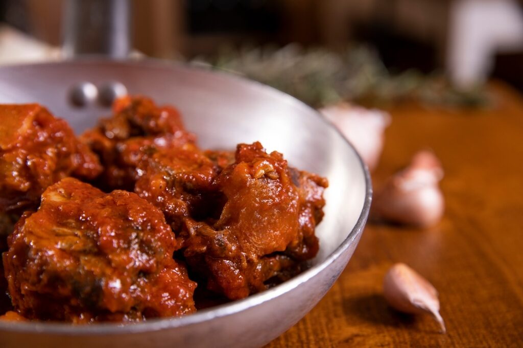 Bowl of tender coda alla vaccinara