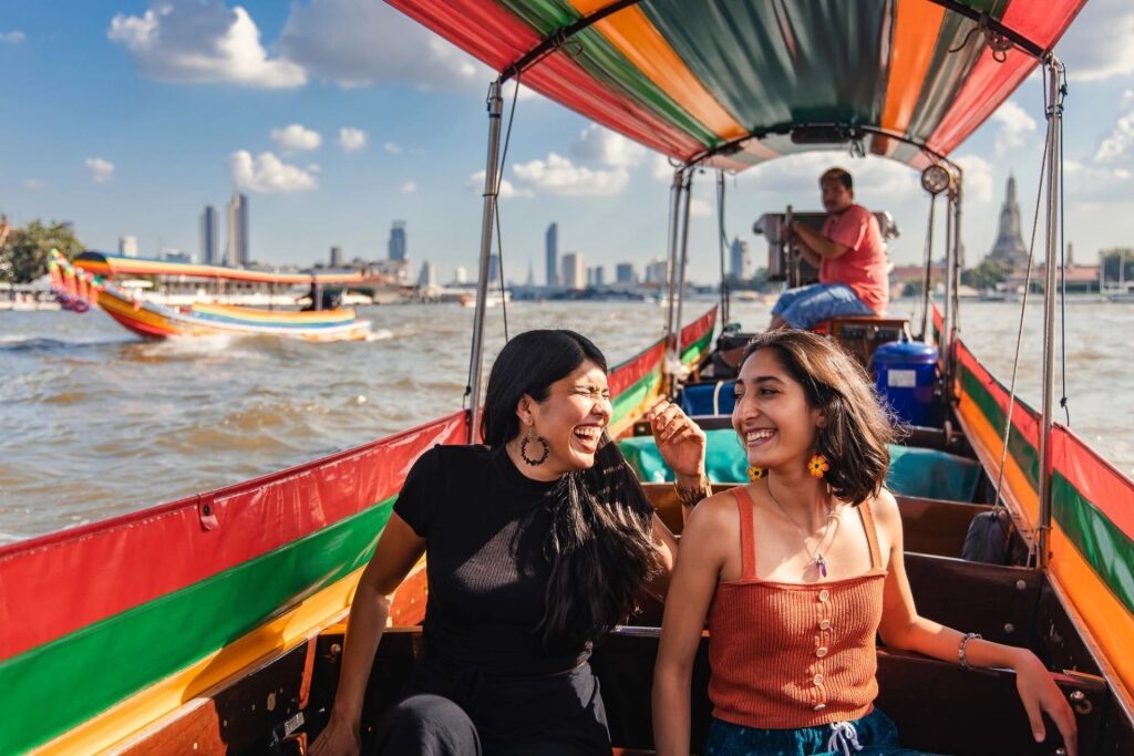 People on a boat tour in Bangkok, Thailand