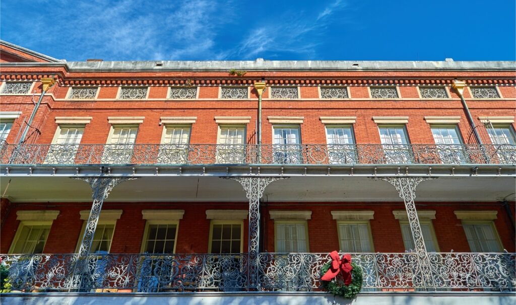 Red facade of the Pontalba Buildings