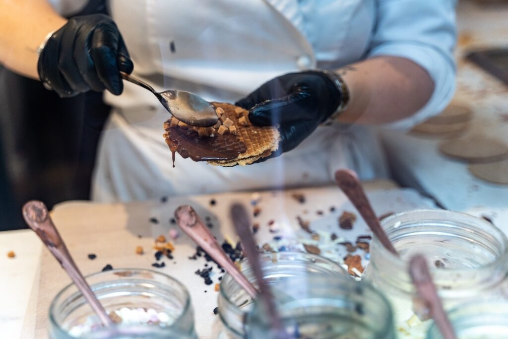 Man preparing stroopwafel at a store in Amsterdam