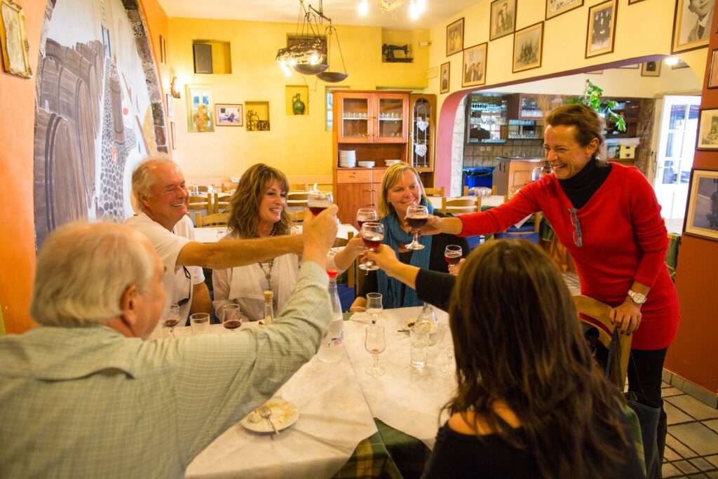 People eating at a restaurant in Santorini