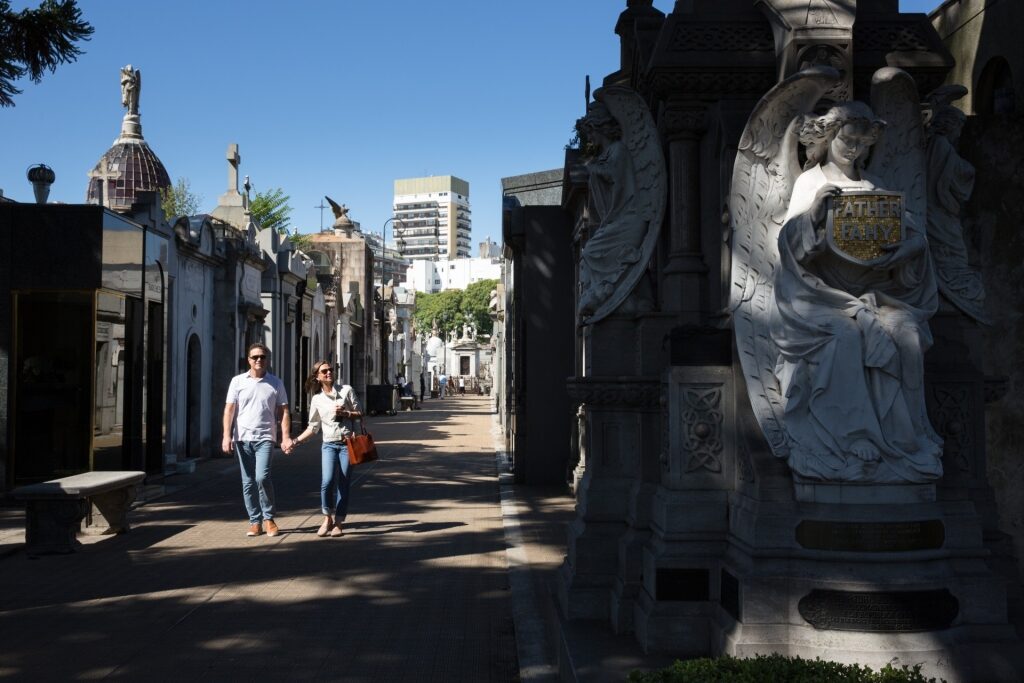 Couple exploring Recoleta Cemetery