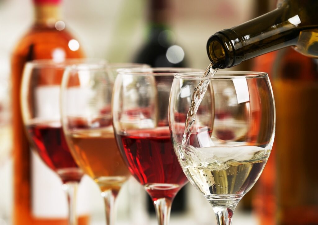 Person pouring Turkish wine into a glass