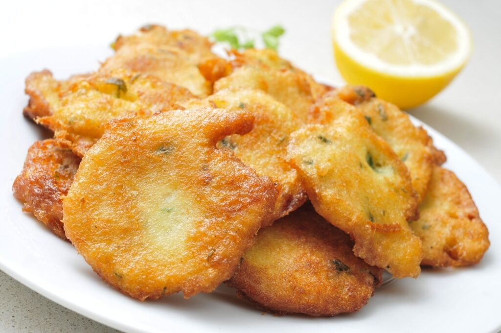 Savory saltfish fritters on a plate