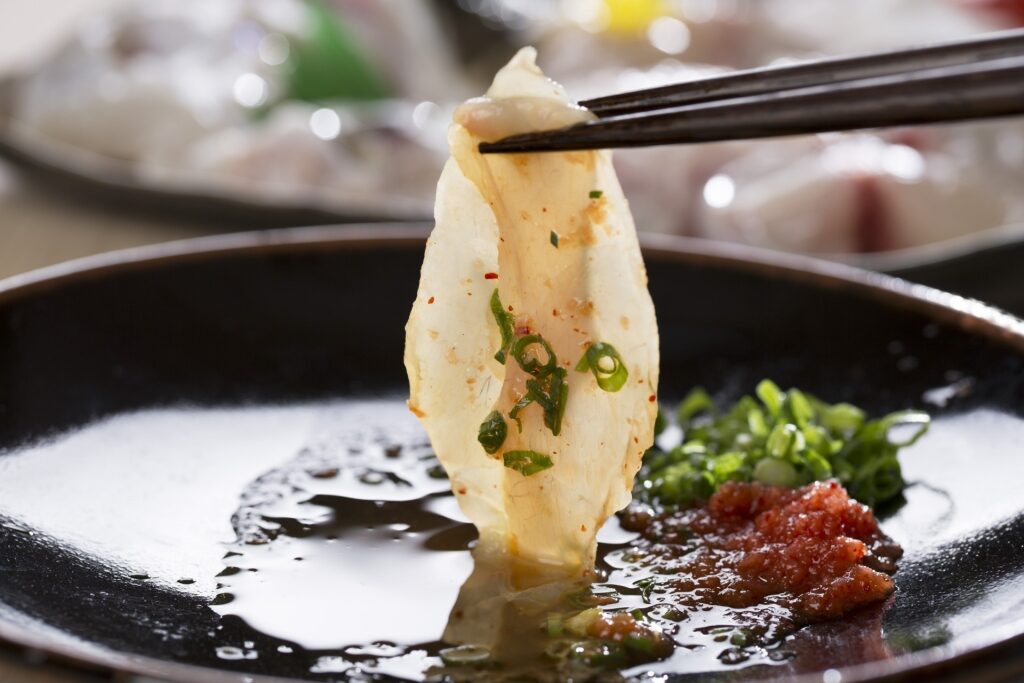 Fugu sashimi with dipping sauce