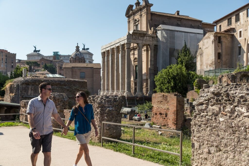 Couple exploring the Roman Forum in Rome, Italy