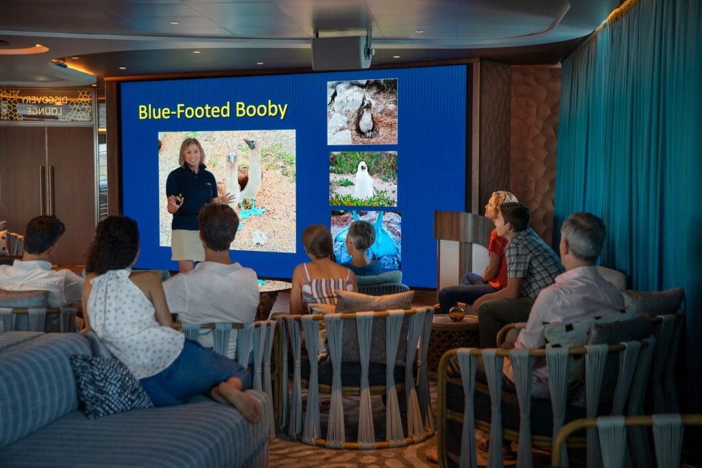 People learning about the Galapagos aboard Celebrity Flora