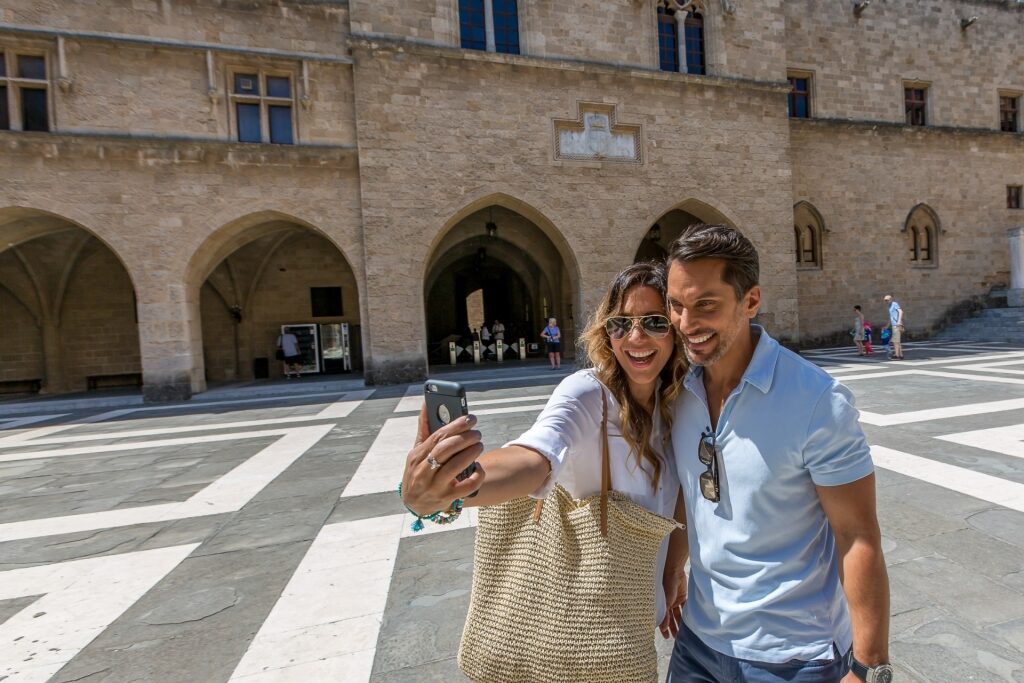 Couple taking a photo from Old Town Rhodes