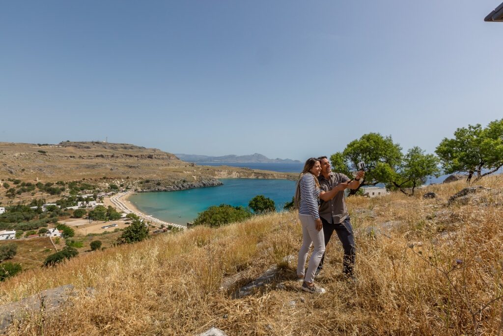 Couple exploring Lindos in Greece